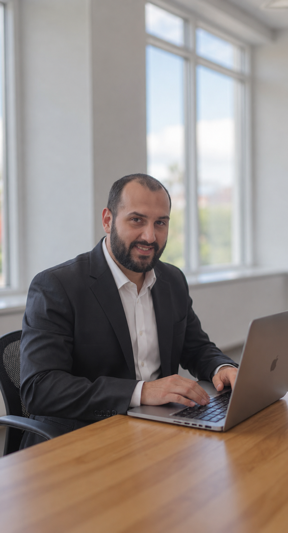 Yassine Essaadi, independent SEO consultant, standing in a professional office environment